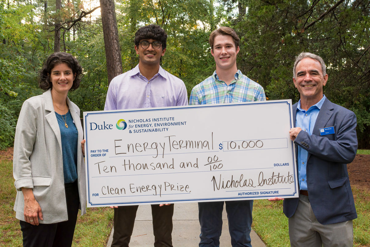 Brian Murray awarding Clean Energy Prize check to students