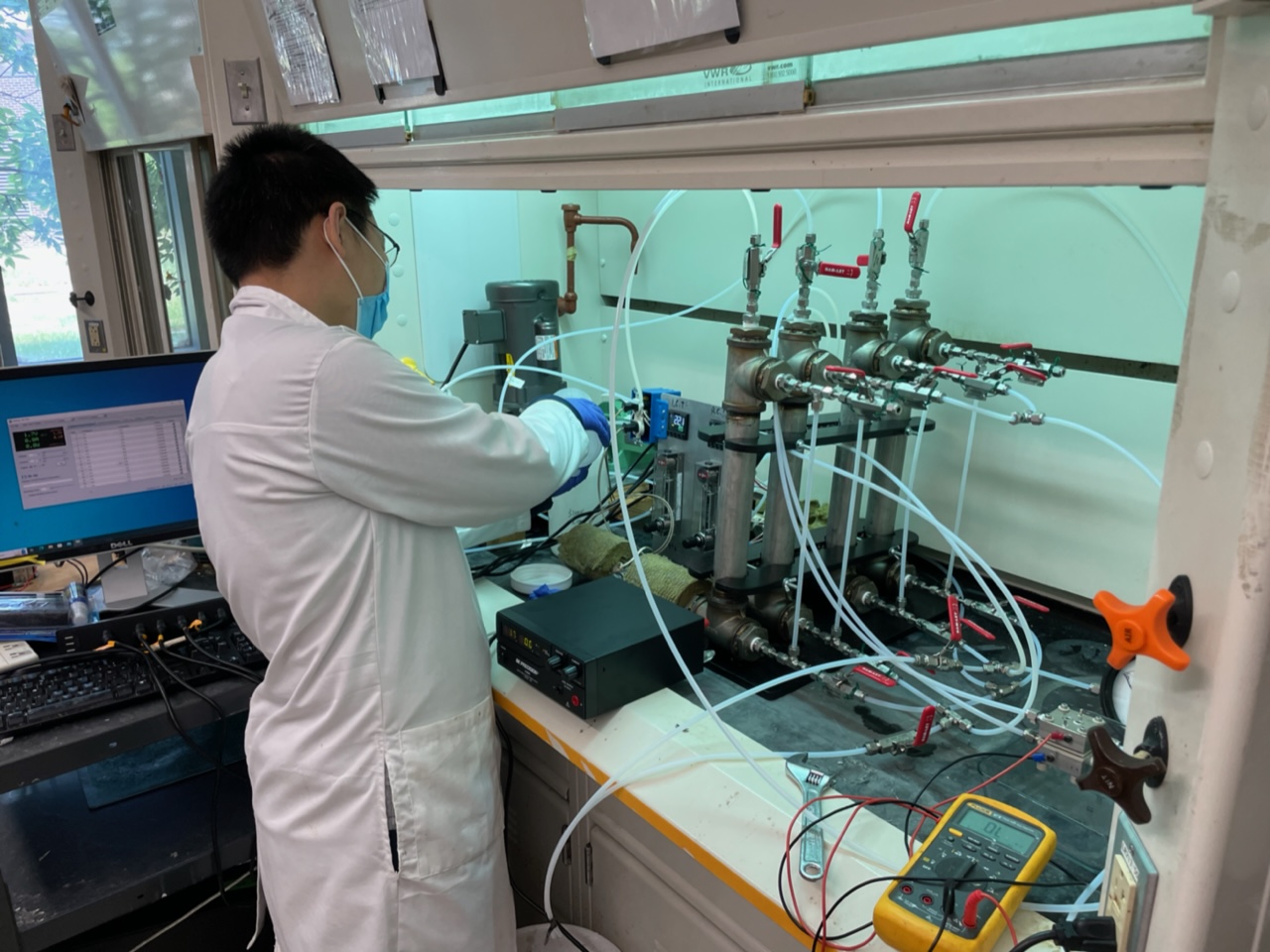 Ph.D. student Shichen Guo working with an electrolyzer for green hydrogen production.